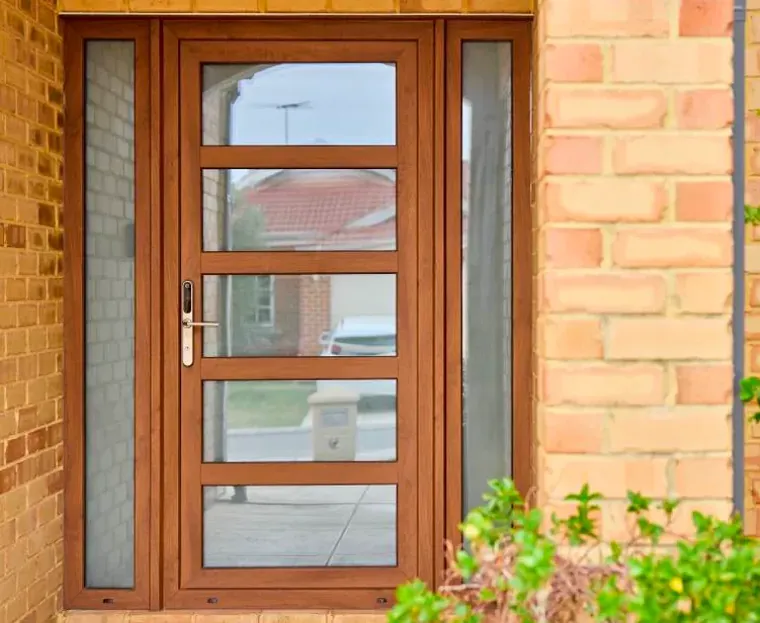 Premier uPVC timber-look entry door with glass side panels