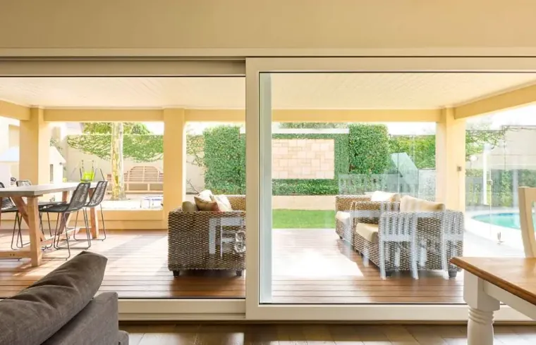 Premier uPVC lift & slide doors to a brick patio