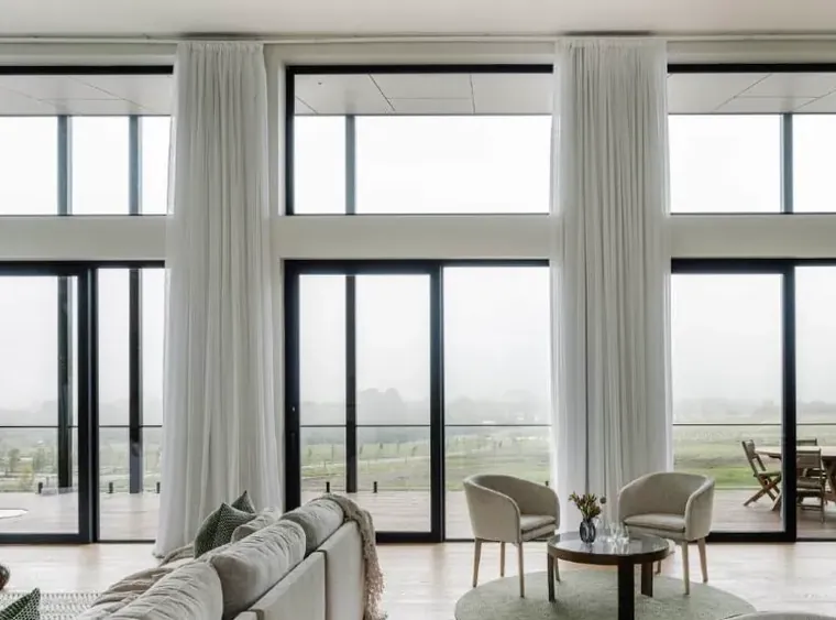 Premier uPVC smart slide doors opening to a rural view